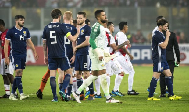 Scotland players at the end of their defeat to Peru.