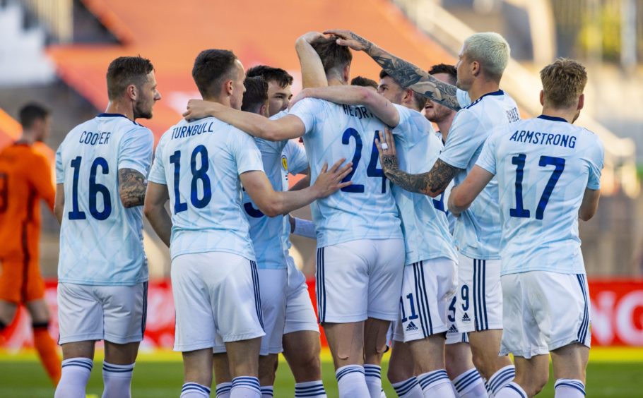 Jack Hendry celebrates opening the scoring for Scotland.