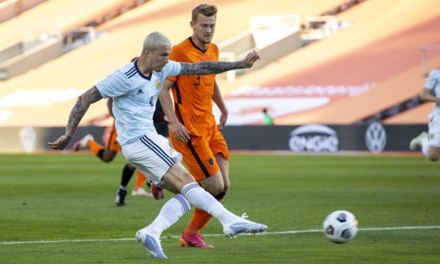 Scotland Forward Lyndon Dykes has a shot on goal during the 2-2 draw with Netherlands.