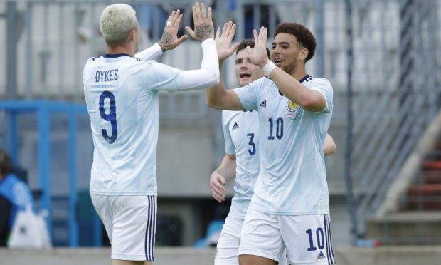 Scotland's Che Adams celebrates making it 1-0 with Lyndon Dykes (left) during the friendly match against Luxembourg.