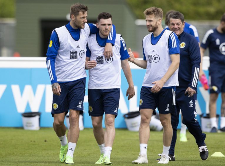 Liam Cooper, Andy Robertson and Stuart Armstrong during a Scotland training session.