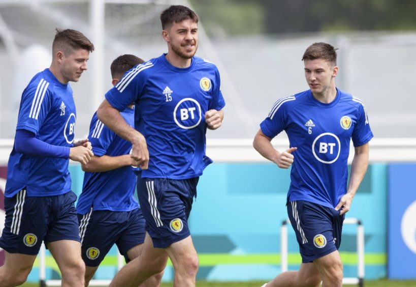 Kieran Tierney (R) remains a doubt for Scotland's trip to Wembley.