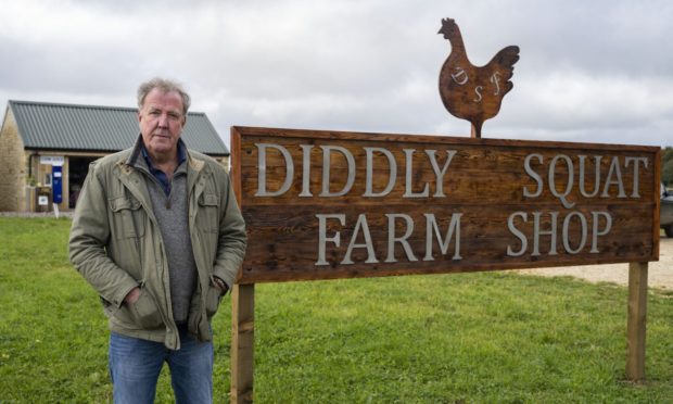 Jeremy Clarkson at the sign for his farm shop. Image: Amazon Prime.