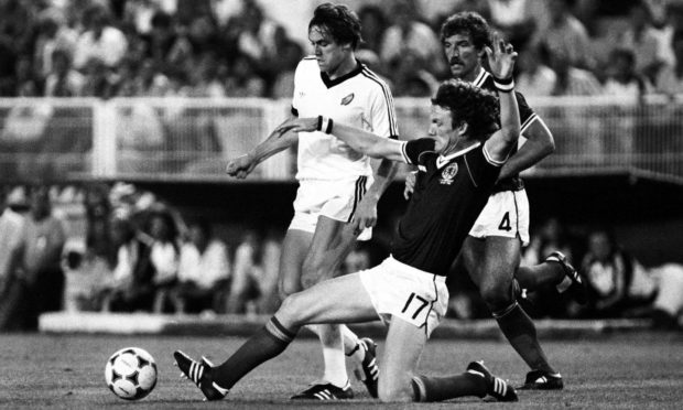 Evans slides as Graeme Souness looks on