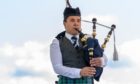 A solo piper competing at the 2019 Aboyne Highland Games