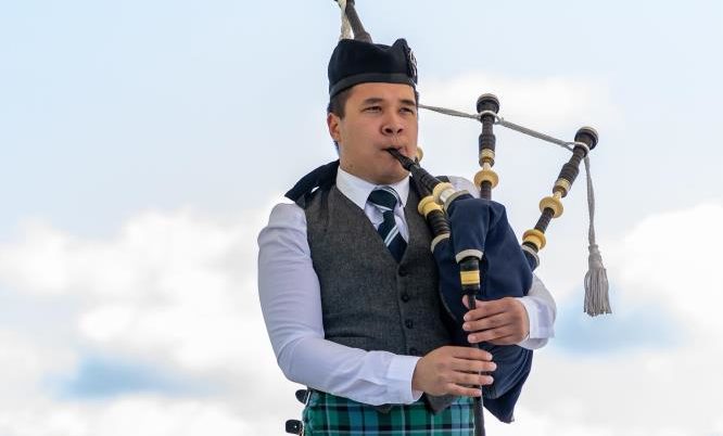 A solo piper competing at the 2019 Aboyne Highland Games.