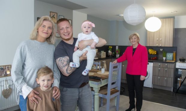 Councillor Jenny Laing with Edyta and Lukasz Kranz and their family who recently moved into the development.