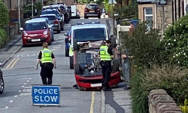 The flipped car on Argyle Street this morning. Picture by Bill Macdonald