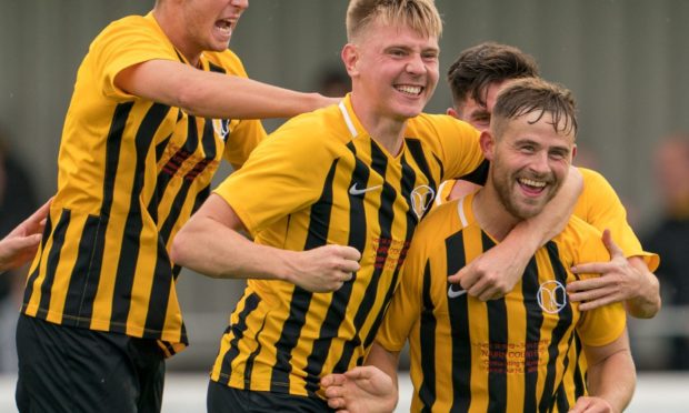 Gordon McNab, right, is pleased to be back at Nairn County