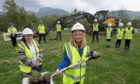 Caol Primary School pupil Isla Ross and Joan Ling of Caol Community Council helped dig the first turf to mark the beginning of work on  the new flood defences.