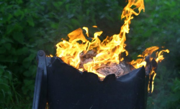 Wheelie bin on fire.