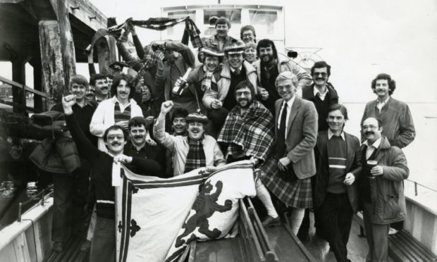 A group of Scotland supporters who watched the Scotland v Brazil game on board the Tay Queen in 1982.