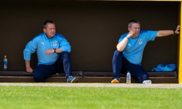 Billy Dodds, left, and Barry Wilson watching the pre-season action between ICT and Forres.