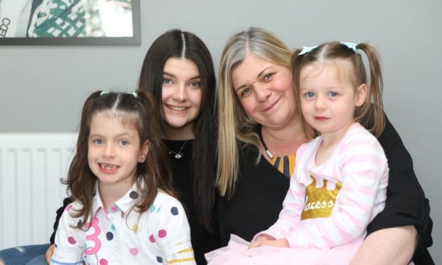 Georgia Bendall and her daughters.