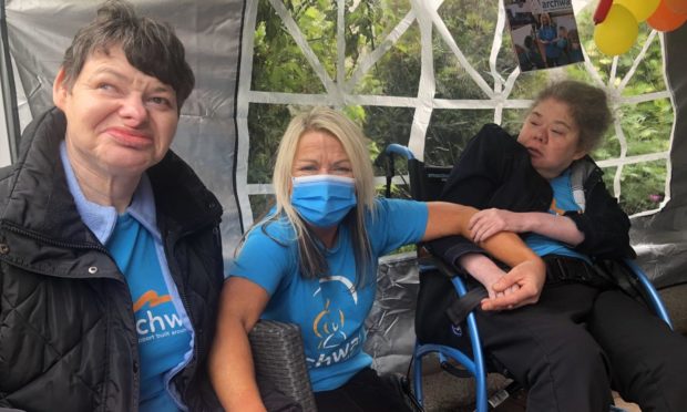 Archway care worker Tracey Smith braves a shave in support of people living with learning and mobility disabilities. Picture shows: Tracey Smith with two of the ladies she cares for - Kirsteen and Lesley.