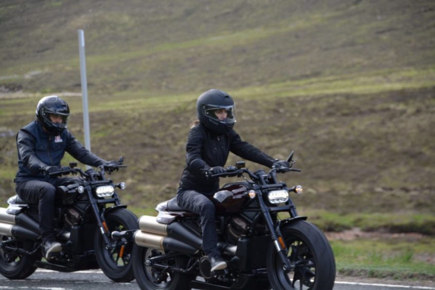 These exclusive images show film crew and stunt people filming a high speed motorbike chase through the Scottish Highlands. PICS: SWNS