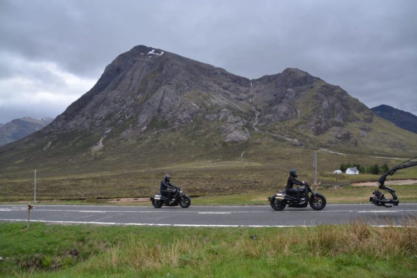 These exclusive photos of stunt actors racing on motorbikes through the village of Glencoe, western Scotland. PICS: SWNS