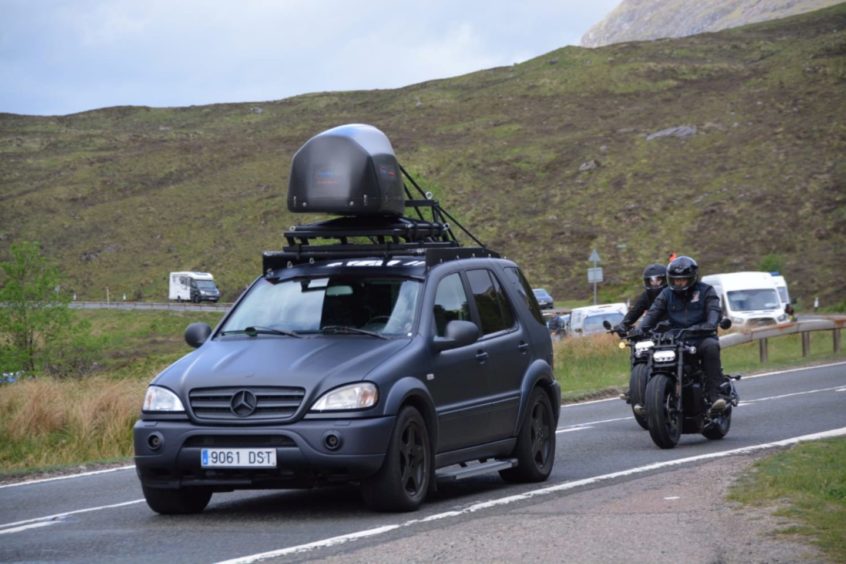 These exclusive photos of stunt actors racing on motorbikes through the village of Glencoe, western Scotland. PICS: SWNS