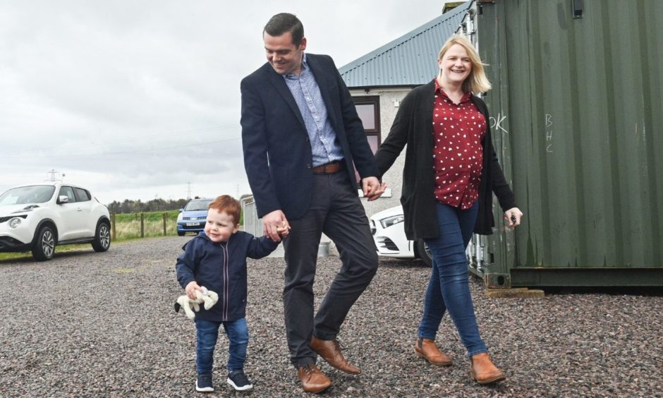 Douglas Ross with his wife Krystle and son Alistair.