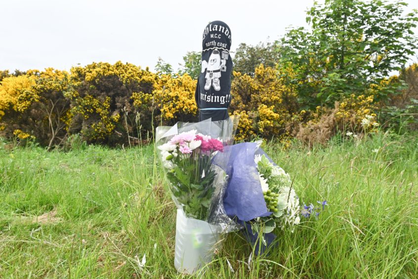 Tributes at the scene where motorcyclist Paul Fairbairn was killed.