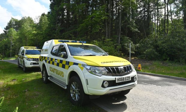 Search team members Pete Crichton and search dog Gem from SARDA Scotland are pictured near Craig Dunain Duck Pond in Inverness in the search for a missing vunerable person.
Pictures by JASON HEDGES