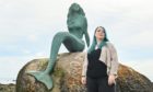 Laura Kirk, pictured here at the popular mermaid sculpture in Balintore, is steeped in the folklore and tradition of the Seaboard villages