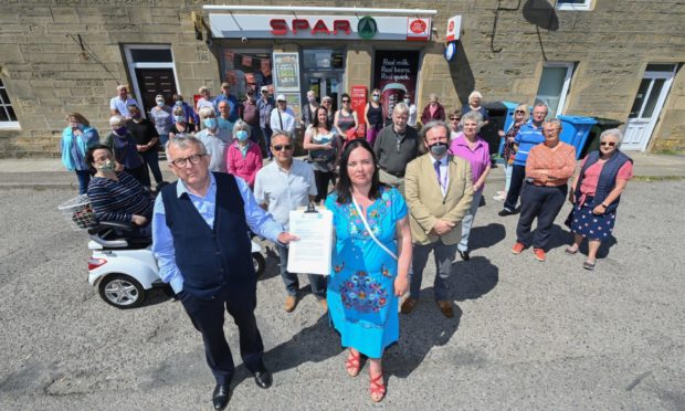 Angry residents gathered outside the Spar and Post office in Balintore prior to the letter being submitted.