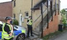 Police at the scene of a sudden death in Inverness