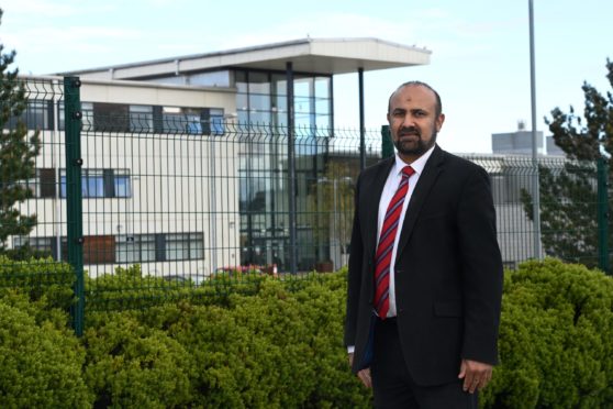 Councillor Malik outside Cults Academy.