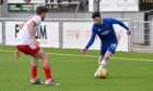 Adam Livingstone in action for Cove Rangers.