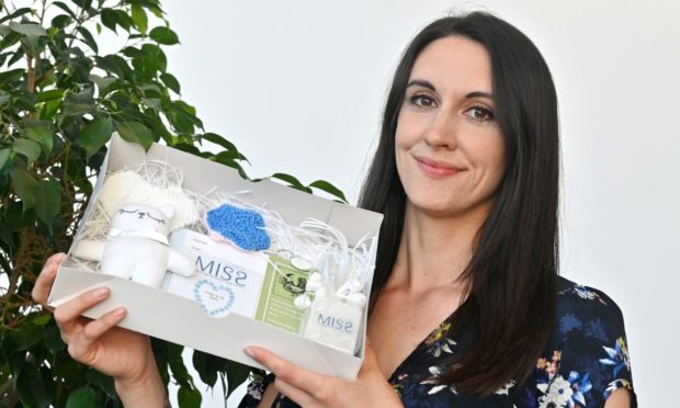 Abi Clarke (Miss chairwoman) with a memory box for early pregnancy loss.