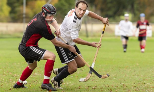 Lovat's Ryan Ferguson (right) is marked closely by Gary Lord (Oban).