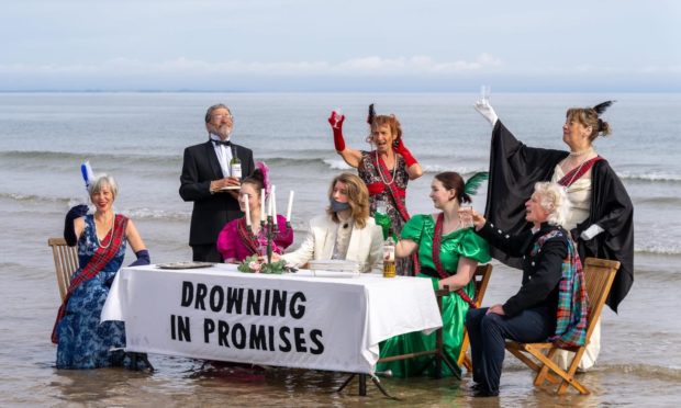 The activists set up a table on Findhorn Beach near Forres. Picture by Brian Smith/JasperImage