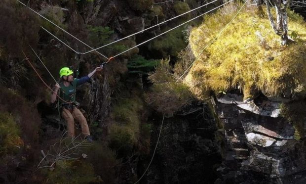 A worker clearing rhododendron at Corrieshalloch Gorge