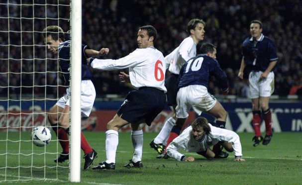 Scotland striker Don Hutchison celebrates his goal during a Wembley win in 1999