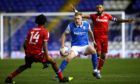Birmingham City's Sam Cosgrove (centre) battles for the ball with Reading's Liam Moore (right) and Ovie Ejaria during a Sky Bet Championship match.