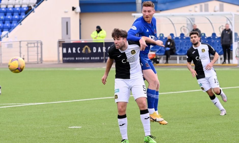 Morgyn Neill in action for Dumbarton against Cove Rangers.