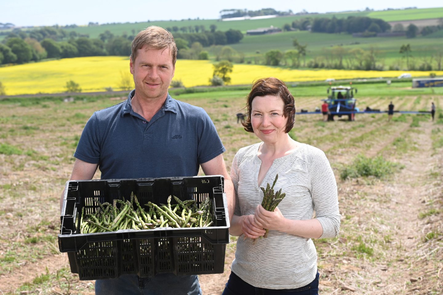 Neil and Jillian McEwan posing with a box of Lunan Bay Farm asparagus