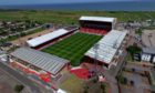 Five have been charged in connection to pyrotechnics being set alight within Pittodrie. Photo: Kenny Elrick.