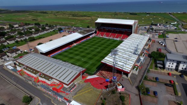Five have been charged in connection to pyrotechnics being set alight within Pittodrie. Photo: Kenny Elrick.