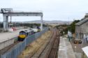 A train of waste nuclear fuel from Dounreay is prepared at the Georgmass railway sidings between Thurso and Wick for its journey south.