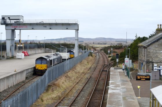 A train of waste nuclear fuel from Dounreay is prepared at the Georgmass railway sidings between Thurso and Wick for its journey south.