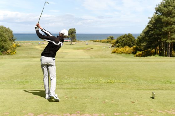 Calum Scott drives on the 14th. Pictures by Sandy McCook