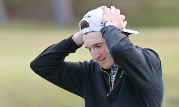 A feeling of disbelief as Calum Scott walks back to the clubhouse after beating Harley Smith at the 19th. Pictures by Sandy McCook