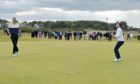 The moment on the 38th hole when Laird Shepherd, right, became the Amateur Championship winner.  Picture by Sandy McCook
