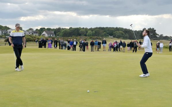 The moment on the 38th hole when Laird Shepherd, right, became the Amateur Championship winner.  Picture by Sandy McCook