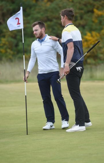 Laird Shepherd is congratulated by Monty Scowsill at the end of an epic final.