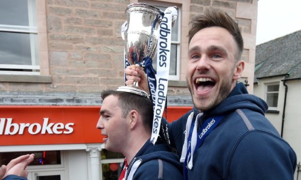 Keith Watson, right, celebrates winning the Championship with Ross County in 2019. Picture by Sandy McCook