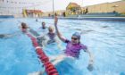 Swimmers at the Stonehaven Open Air Pool in Aberdeenshire, which has reopened after lockdown restrictions were eased.