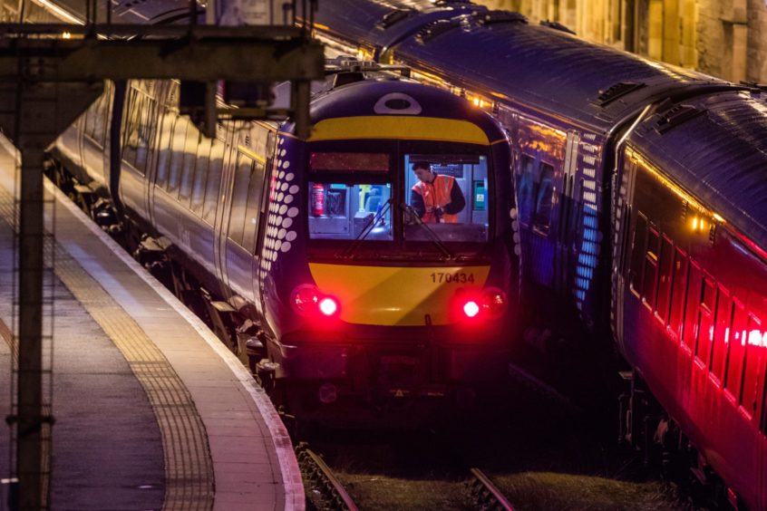 Cleaning the trains at Perth Train Station.